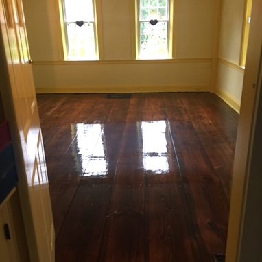 glossy brown hardwood flooring for a room